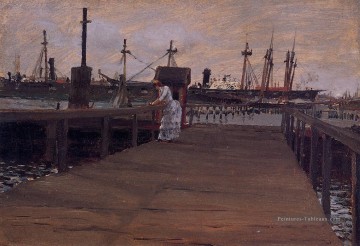 Femme sur un quai William Merritt Chase Peinture à l'huile